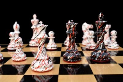 Does The Chess Board Include? The Chess Board in the picture is for Photography and does not include with The Zebra Series Chessmen set. Chess Pieces Height Base Diameter King 4” (102mm) 1.75” (45 mm) Pawn 1.88” (48mm) 1.25” (32mm) Total Weight of the Zebra Series Chess Pieces: 1400 grams or (50 Ounce) Light Wood Chess Pieces: Boxwood white lacquered. Dark Wood Chess Pieces: Boxwood Black lacquered. Recommended Chess Board for The Zebra Series: 2.” Square Size or 50 mm square size. Please note our all products are hand crafted and there is few chances variation for 5% plus or minus.